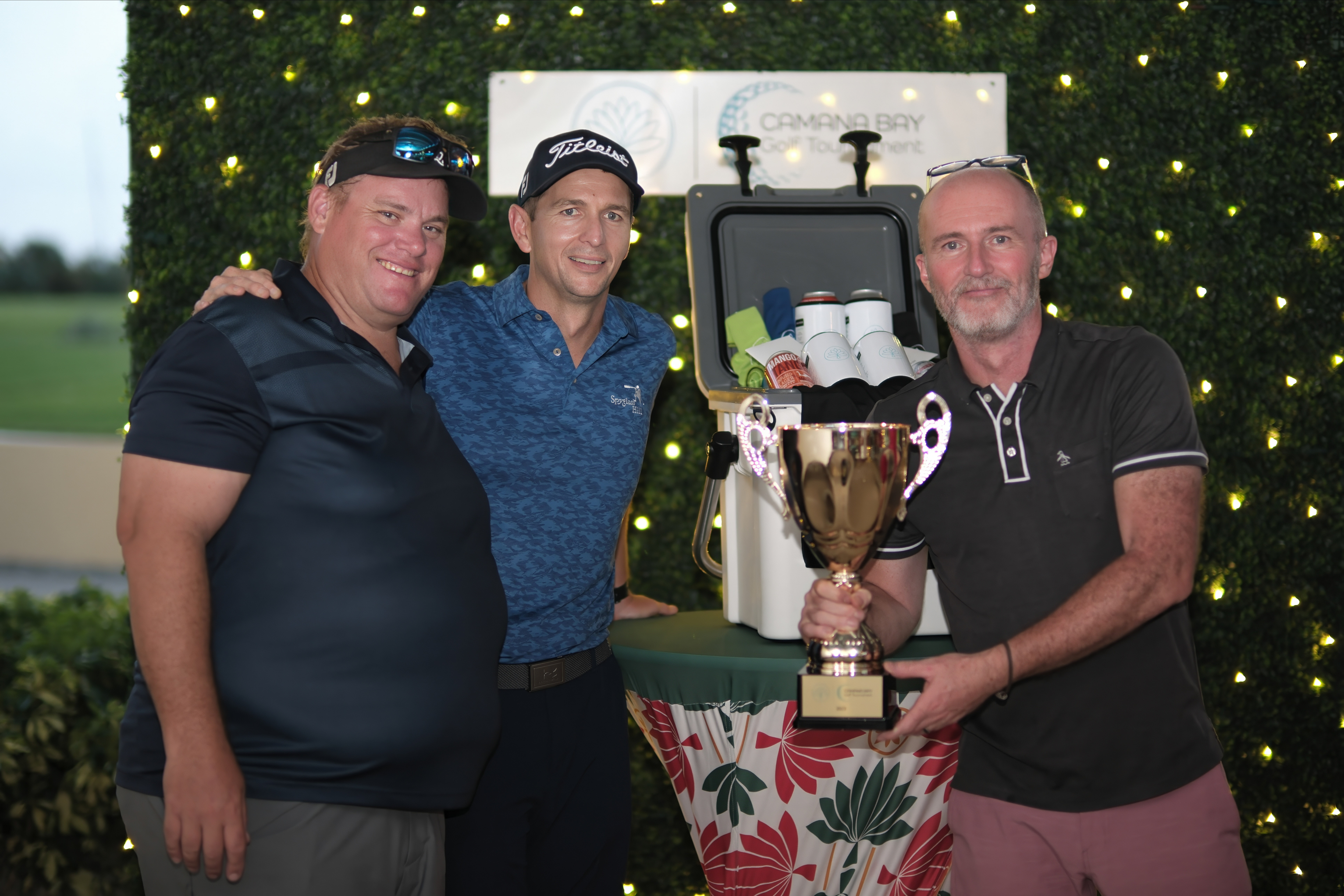 golfers with winning cup