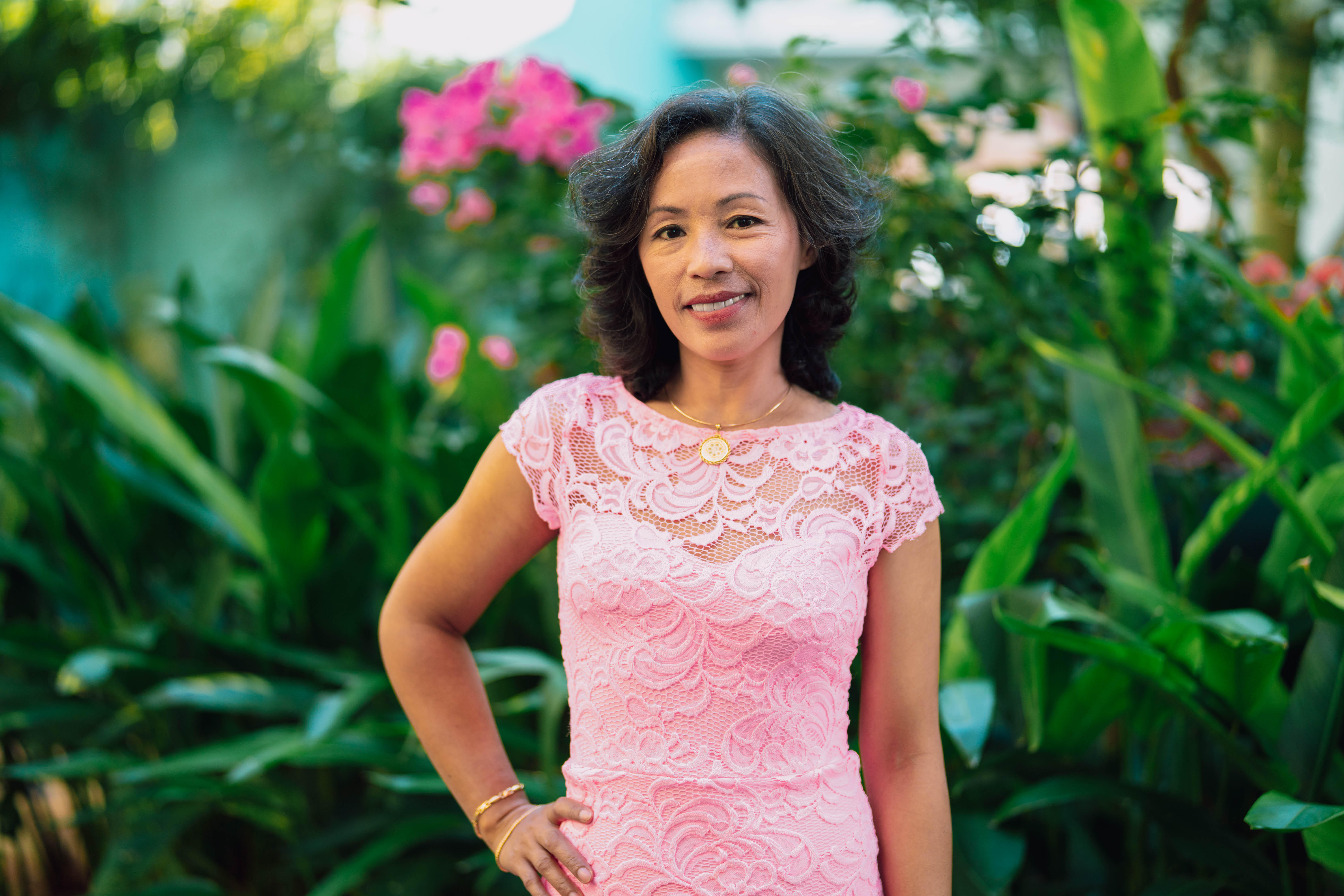 Woman in pink smiling at camer