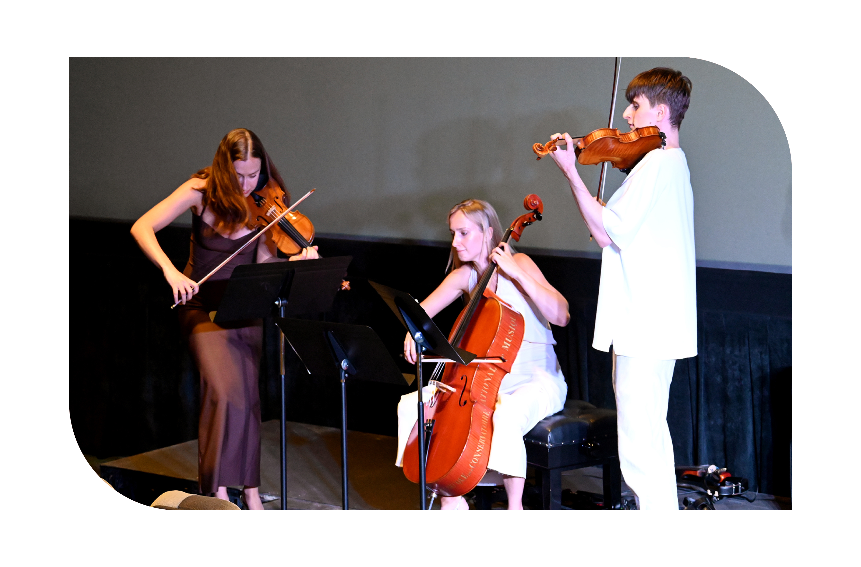 Three musicians playing string instruments