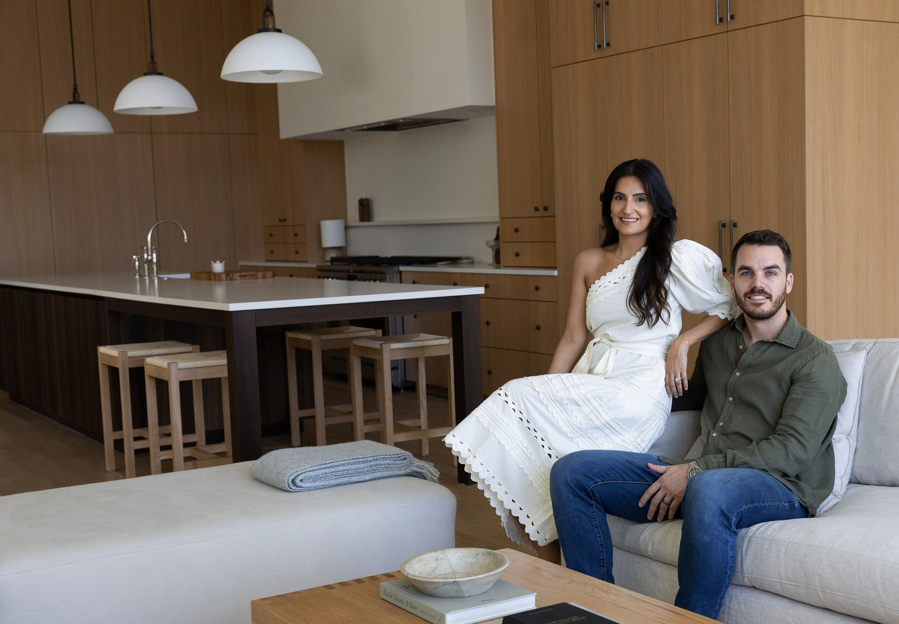 Store owners sitting in kitchen