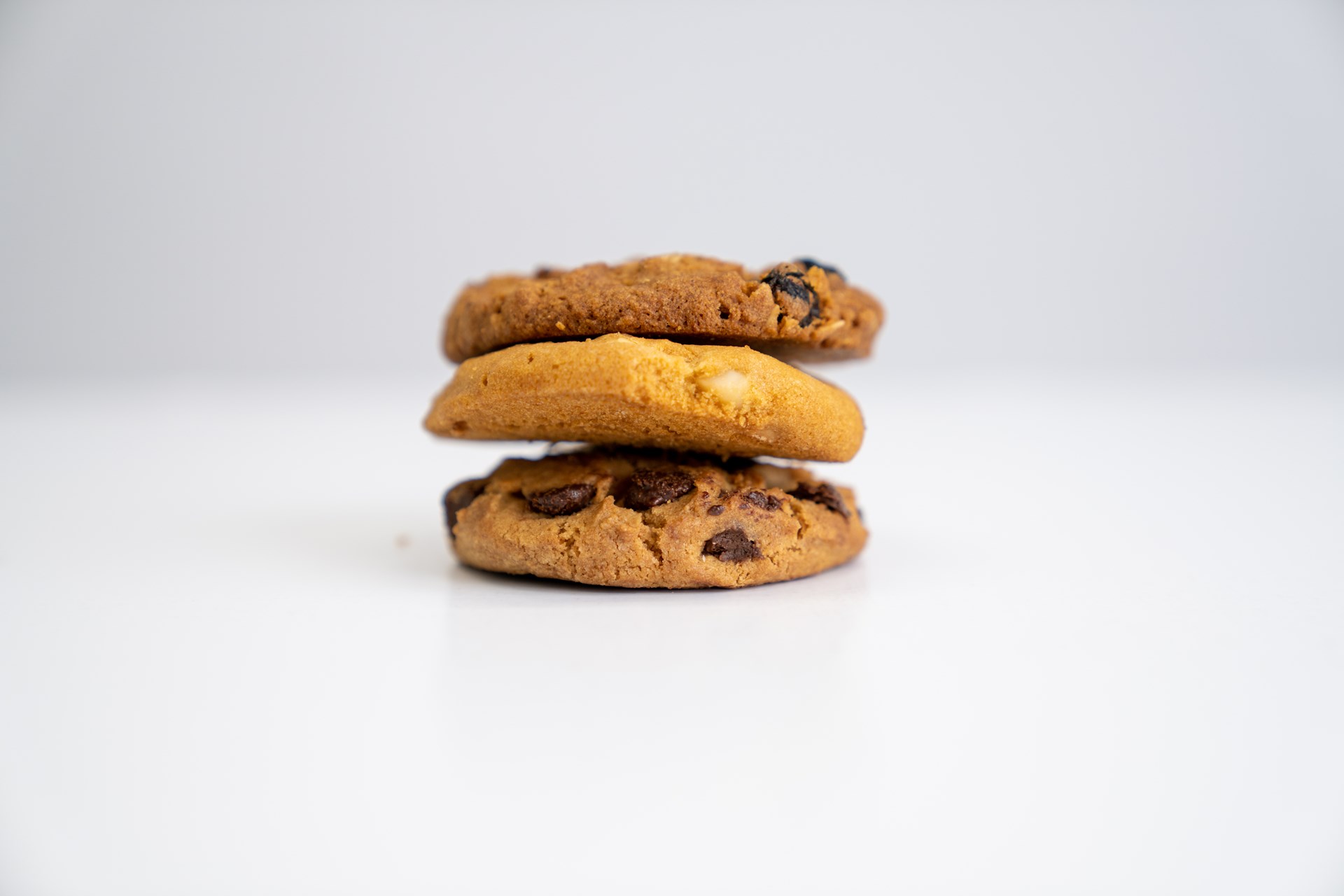 Three cookies of different flavours stacked on top of each other