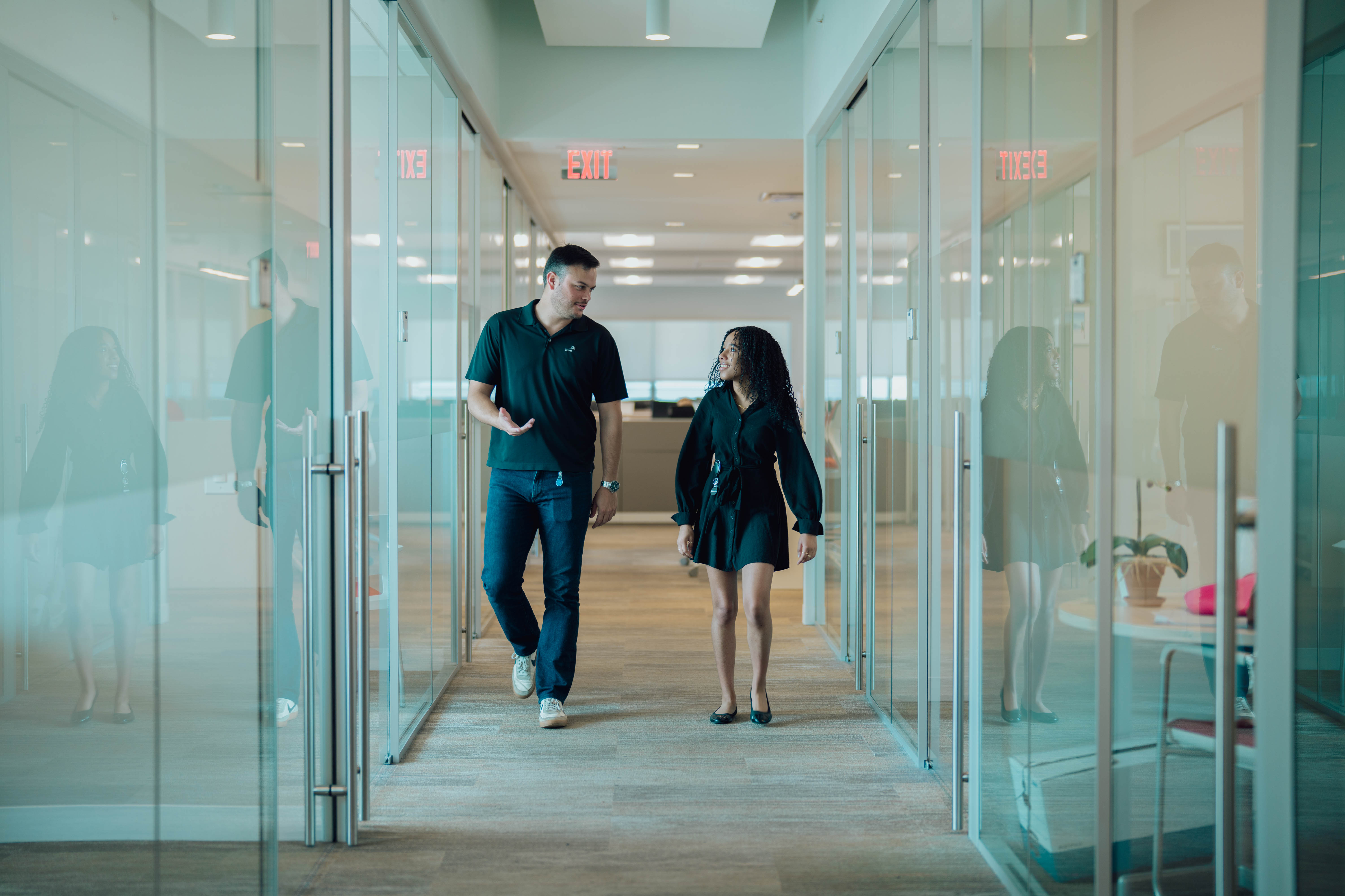 Intern walks hallway with supervisor