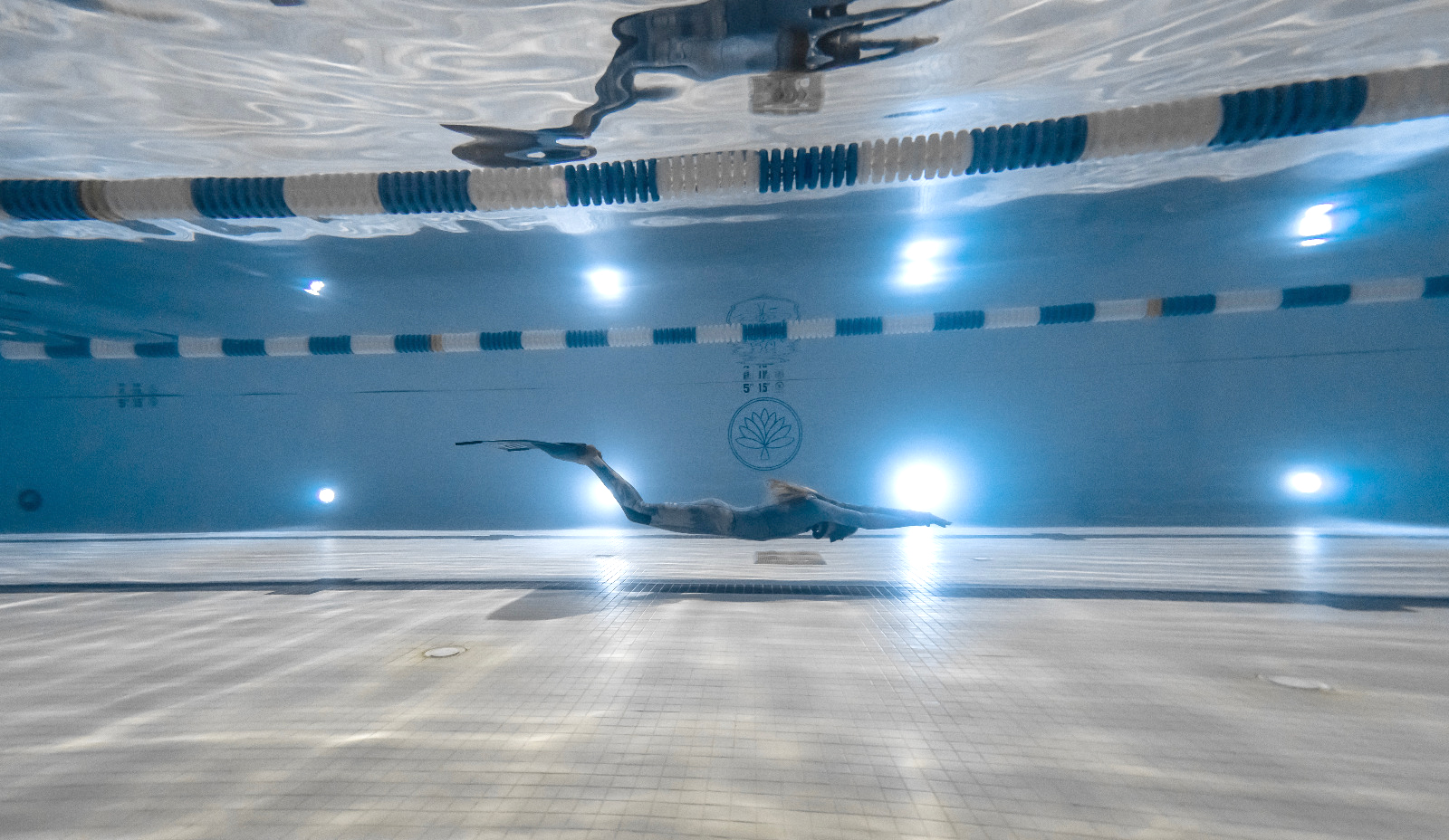 freediver training in swimming pool